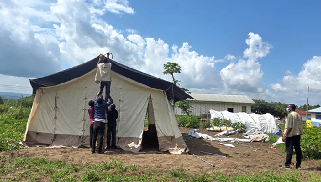 Aid workers set up an Ebola treatment center in Rwampara, Congo, Tuesday, May 19, 2026. (AP Photo/Dirole Lotsima Dieudonne) Corrects from Bunia to Rwampara