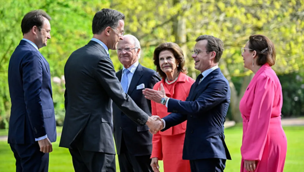 NATO Secretary General Mark Rutte, second from left, shakes hands with Prime Minister of Sweden Ulf Kristersson, as he is greeted by King Carl Gustaf of Sweden, Queen Silvia of Sweden and Minister for Foreign Affairs of Sweden Maria Malmer Stenergard, right, before a dinner at Sofiero Castle in Helsingborg, Sweden, Thursday May 21 2026. (Johan Nilsson/TT News Agency via AP)