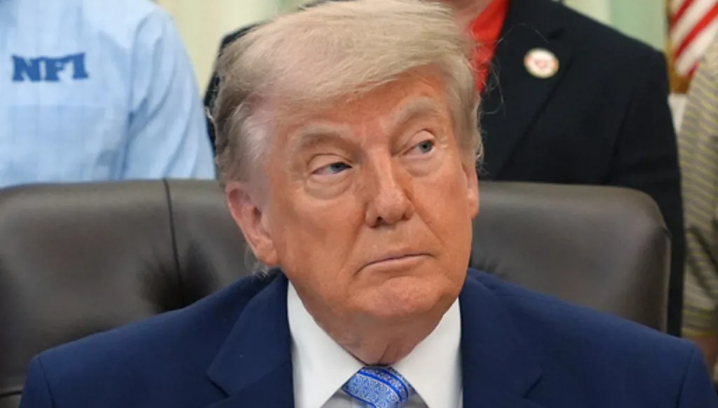 President Donald Trump attends an event about loosening a federal refrigerant rule, in the Oval Office at the White House, Thursday, May 21, 2026, in Washington. (AP Photo/Jacquelyn Martin)