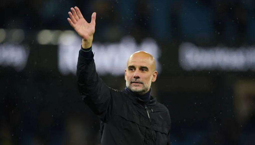 Manchester City's head coach Pep Guardiola greets fans at the end of the English Premier League soccer match between Manchester City and Crystal Palace in Manchester, England, Wednesday, May 13, 2026. (AP Photo/Ian Hodgson)