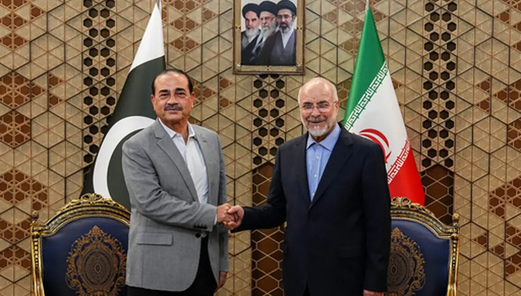 Iran's Parliament Speaker Mohammad Bagher Qalibaf, right, shakes hands with Pakistan's Army Chief Field Marshal Gen. Asim Munir during their meeting in Tehran, Iran, Sunday, May 23, 2026. (Hamed Malekpour/ICANA via AP)