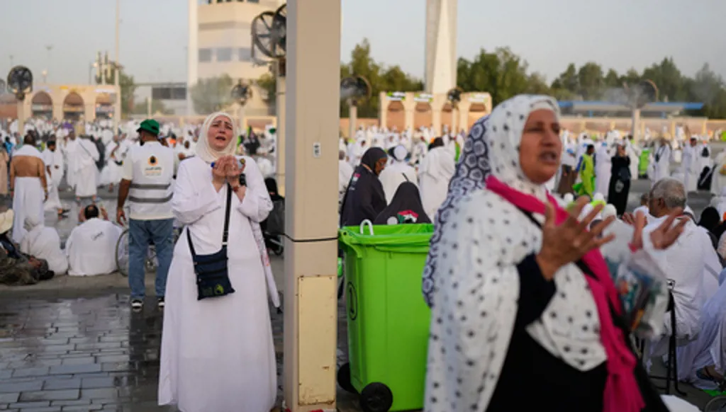 s pray in front of the rocky hill known as Mountain of Mercy, on the Plain of Arafat, during the annual Hajj pilgrimage near the holy city of Mecca, Saudi Arabia, Tuesday, May 26, 2026. (AP Photo/Altaf Qadri)
