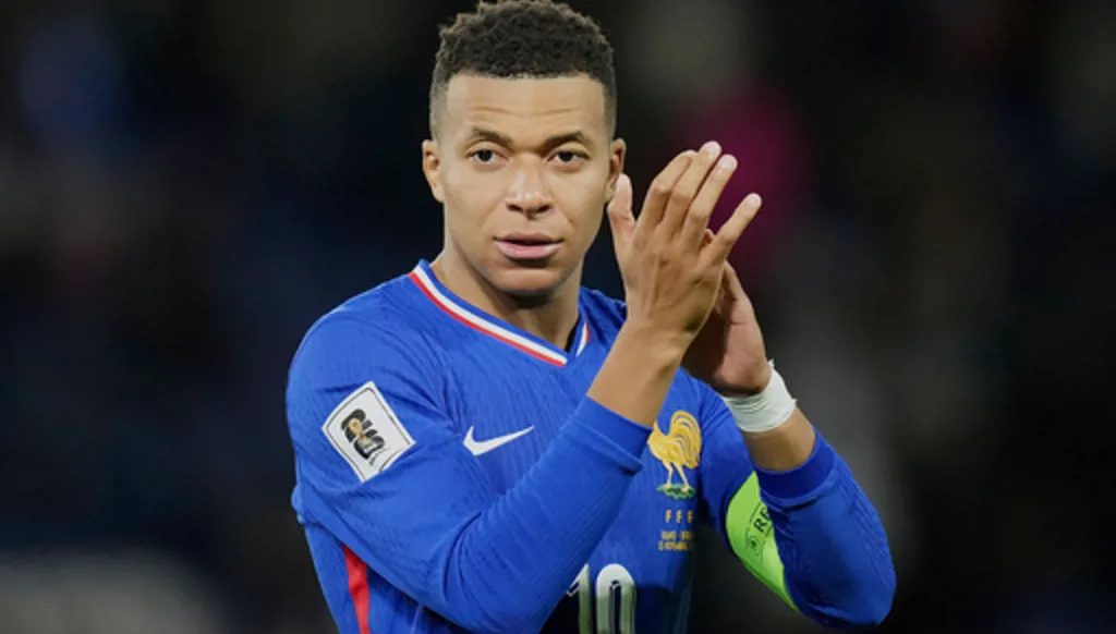FILE - France's Kylian Mbappe celebrates after winning a World Cup 2026 group D qualifying soccer match against Ukraine in Paris, Thursday, Nov. 13, 2025. (AP Photo/Christophe Ena, File)