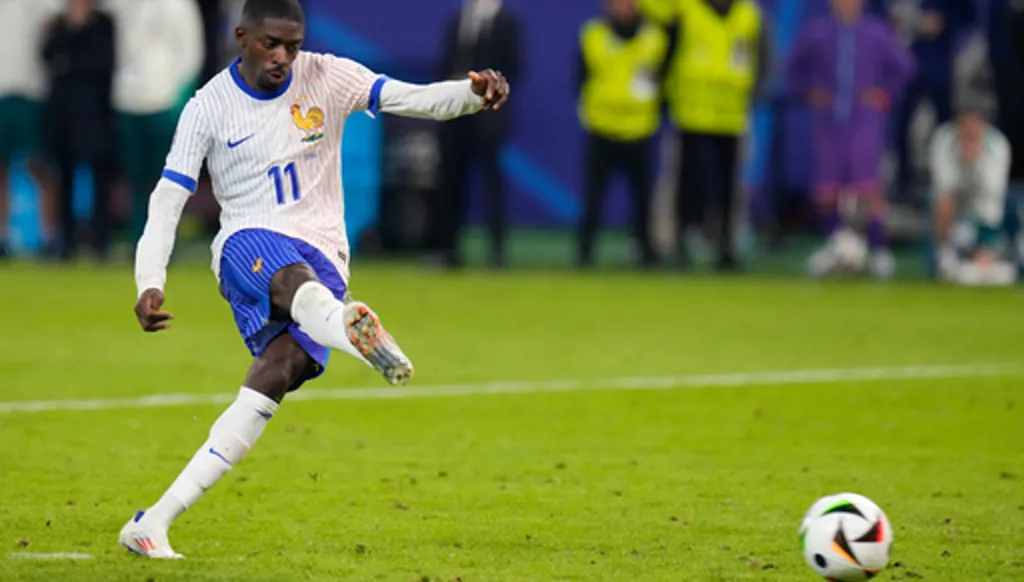 FILE - Ousmane Dembele of France scores during a penalty shootout against Portugal during a quarter final match at the Euro 2024 soccer tournament in Hamburg, Germany, Friday, July 5, 2024. (AP Photo/Hassan Ammar, File)