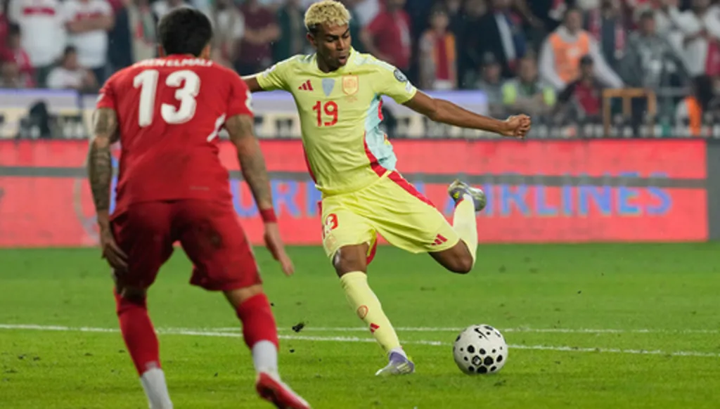 FILE - Spain's Lamine Yamal attempts a shot on goal during a World Cup qualifying round Group E soccer match between Turkey and Spain at Konya Buyuksehir stadium, in Konya, Turkey, Sunday, Sept. 7, 2025. (AP Photo/Khalil Hamra, File)