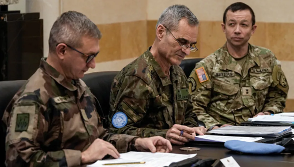 FILE - Members of the committee monitoring the Lebanon-Israel ceasefire, the Head of Mission and Force Commander of the United Nations Interim Force in Lebanon (UNIFIL), Major General Aroldo Lazaro Saenz, of Spain, center, US Maj. Gen. Jasper Jeffers, right, and Gen. Guillaume Ponchamp, of France, left, meet with Lebanese caretaker Prime Minister Najib Mikati, at the government palace in Beirut, Dec. 24, 2024. (AP Photo/Bilal Hussein, File)