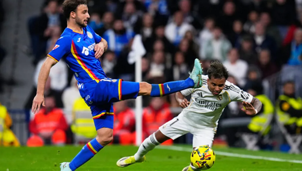 FILE - Getafe's Boselli fights for the ball against Real Madrid's Rodrygo during a Spanish La Liga soccer match between Real Madrid and Getafe in Madrid, Spain, March 2, 2026. (AP Photo/Manu Fernandez, File)