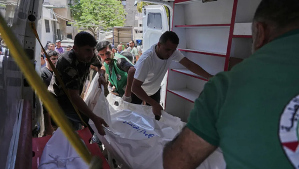 Palestinians carry the bodies of people killed in an Israeli strike, during their funeral in Shifa Hospital in Gaza City, Thursday, June 4, 2026. (AP Photo/Jehad Alshrafi)
