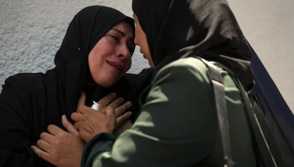 Palestinians attend the funeral of their relatives who were killed in an Israeli strike, in Gaza City, Thursday, June 4, 2026. (AP Photo/Jehad Alshrafi)