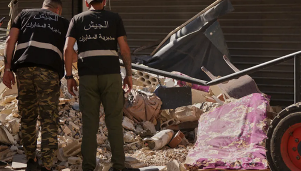 Lebanese intelligence officers look at an unexploded missile, centre, at the site where an Israeli airstrike hit a building in Dahiyeh, Beirut's southern suburb, Lebanon, Sunday, June 7, 2026. (AP Photo/Hassan Ammar)