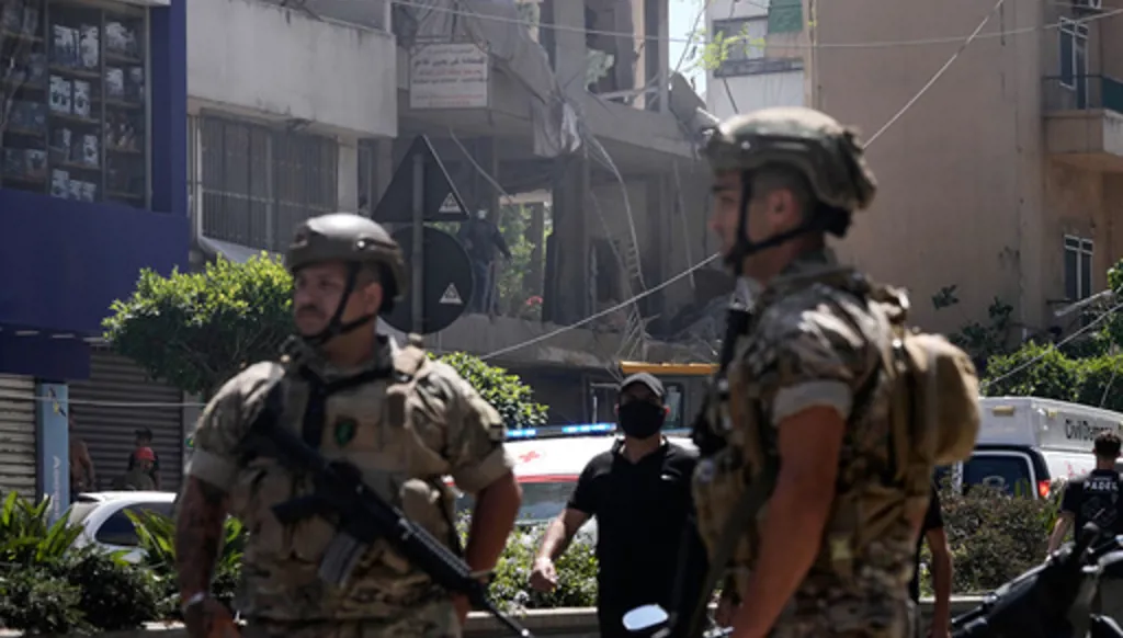 Lebanese soldiers stand guard at the site of an Israeli airstrike that struck an apartment in Dahiyeh, Beirut's southern suburbs, Lebanon, Sunday, June 14, 2026. (AP Photo/Bilal Hussein)