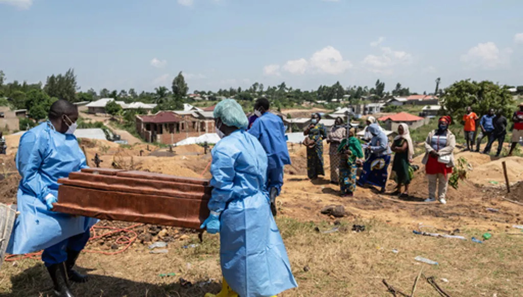 Red Cross workers prepare to bury Vanisa Anifa, a 6-month-old orphaned girl who died of Ebola, at the Bigo Cemetery, in Bunia, Congo, Friday, June 19, 2026. (AP Photo/Moses Sawasawa)