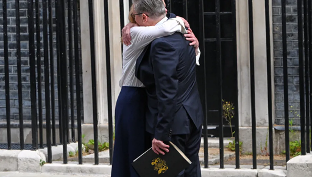Britain's Prime Minister Keir Starmer hugs his wife Victoria after he announced his resignation outside 10 Downing Street in London, Monday, June 22, 2026.AP Photo/Thomas Krych)