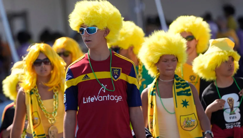 Australia fans don yellow wigs before the World Cup Group D soccer match between Paraguay and Australia in Santa Clara, Calif., near San Francisco, Thursday, June 25, 2026. (AP Photo/Jeff Chiu)