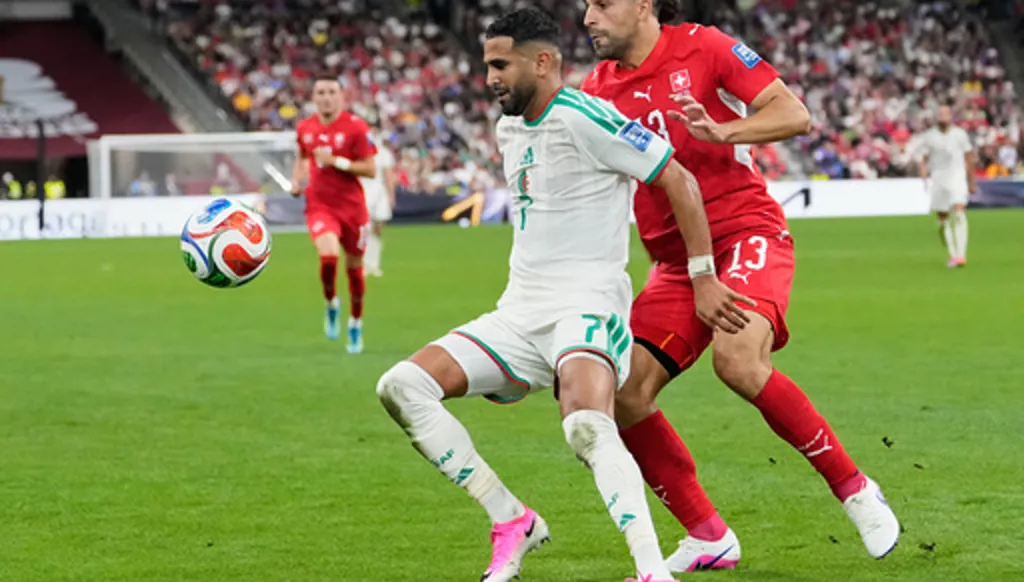 Algeria's Riyad Mahrez (7) and Switzerland's Ricardo Rodriguez (13) during the World Cup round of 32 soccer match between Switzerland and Algeria in Vancouver, British Columbia, Thursday, July 2, 2026. (AP Photo/Lindsey Wasson)