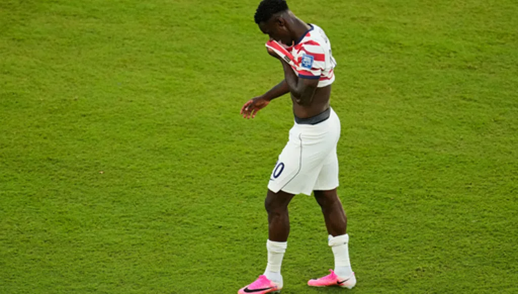 United States' Folarin Balogun (20) walks off the field after receiving a red card during the World Cup round of 32 soccer match between the United States and Bosnia in Santa Clara, Calif., near San Francisco, Wednesday, July 1, 2026. (AP Photo/Jeff Chiu)