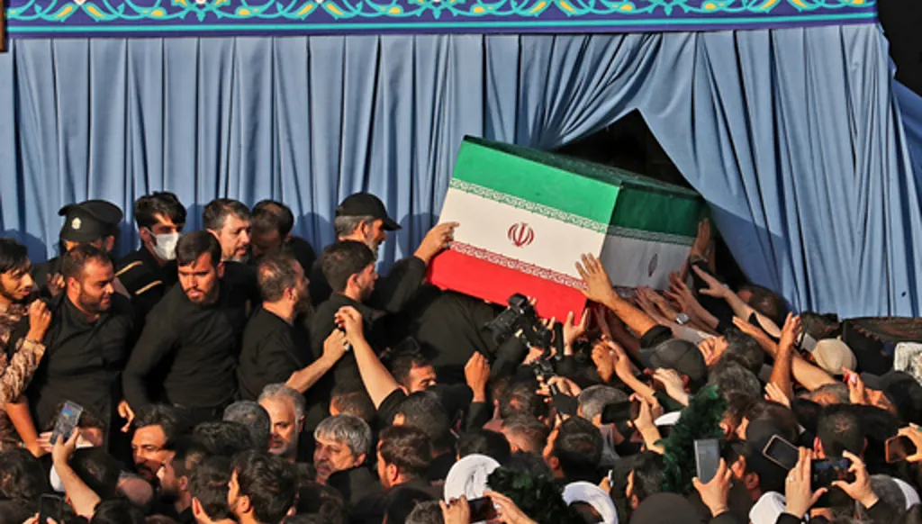 In this photo released by Iran's Supreme Leader's office, mourners carry the coffin of the late Iranian Supreme Leader Ayatollah Ali Khamenei during funeral prayers held as part of the dayslong funeral ceremonies at the Holy Jamkaran Mosque in Qom, Iran, Tuesday, July 7, 2026. (Office of the Iranian Supreme Leader via AP)
