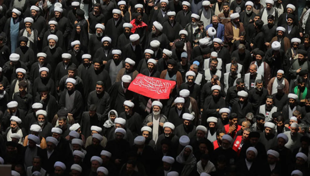 Shiite clerics join other mourners during the funeral procession for the late Iranian Supreme Leader Ayatollah Ali Khamenei inside the Imam Ali Shrine in Najaf, Iraq, Wednesday, July 8, 2026. (AP Photo/Anmar Khalil)
