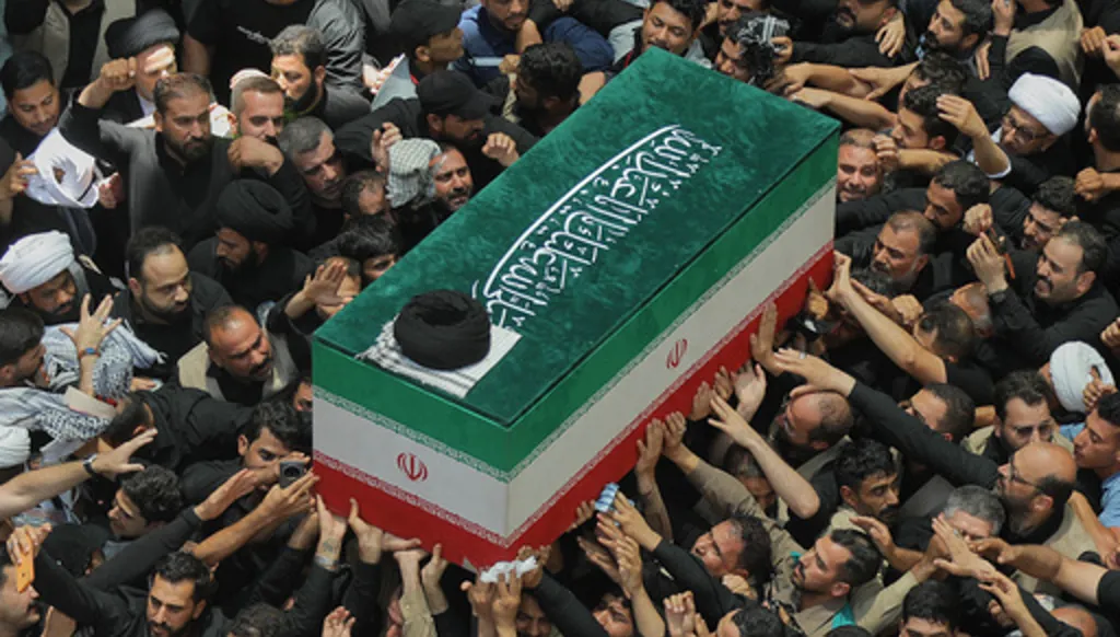 The coffin of the late Iranian Supreme Leader Ayatollah Ali Khamenei is carried by mourners to the Imam Ali Shrine in Najaf, Iraq, Wednesday, July 8, 2026. (AP Photo/Anmar Khalil)