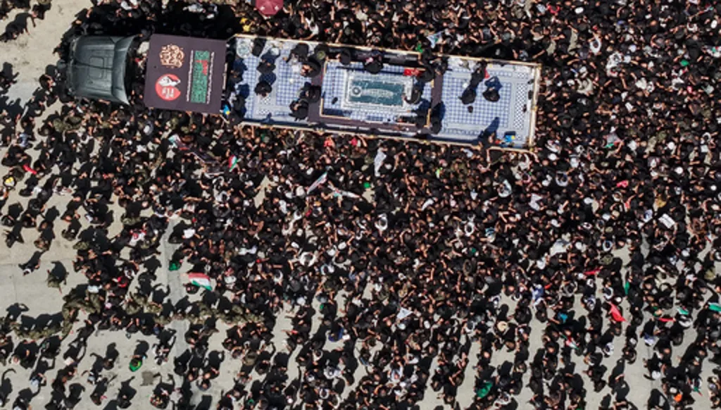 A truck carrying the coffin of the late Iranian Supreme Leader Ayatollah Ali Khamenei makes its way through mourners during a funeral procession in Najaf, Iraq, Wednesday, July 8, 2026. (AP Photo/Anmar Khalil)