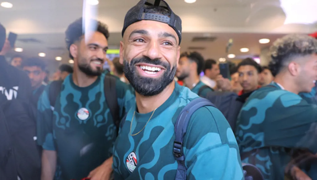 Mohamed Salah, smiles as he is greeted by fans upon the Egyptian national soccer team arrival at El-Alamein airport, 160 km (99 miles) west of Alexandria, Egypt, Friday, July 10, 2026. (AP Photo)