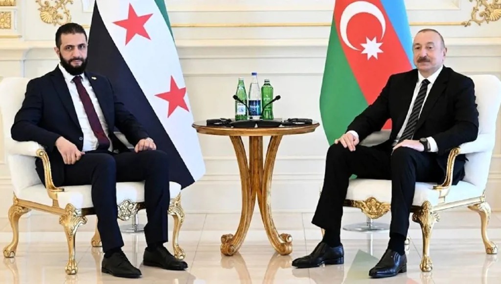 الرئيسان السوري والاذري في باكو (وكالات).