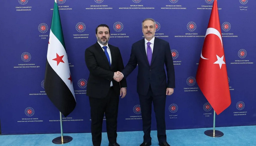 وزيرا الخارجية التركي والسوري. (أ ف ب)