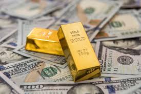 الذهب والدولار (وكالات)