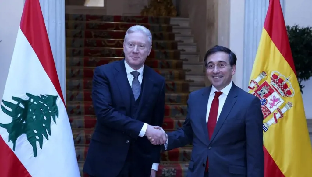 رجي من مدريد: ملتزمون بحصر السلاح بيد الدولة