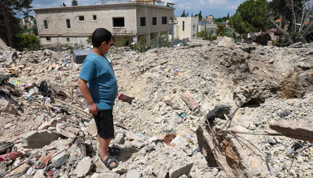 Destruction in Kfar Sir. (AFP)