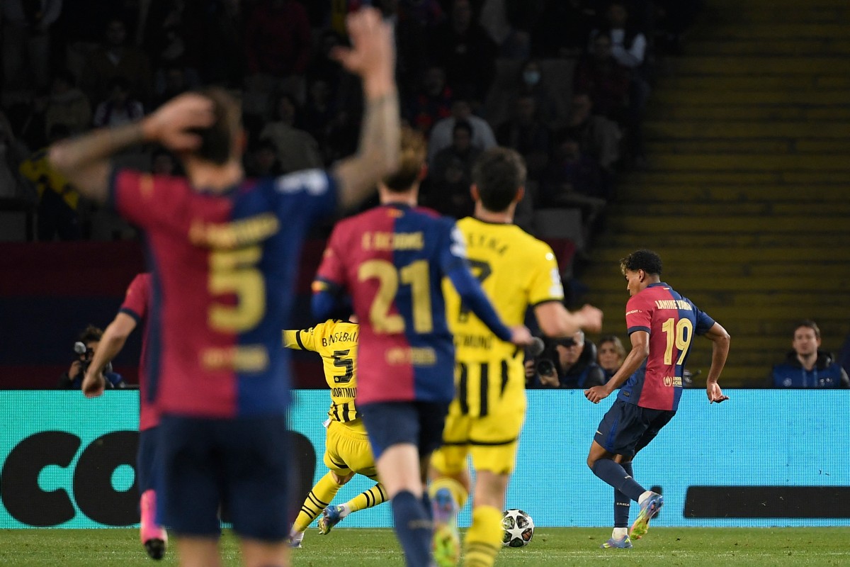 من مباراة برشلونة ودورتموند. (أ ف ب)