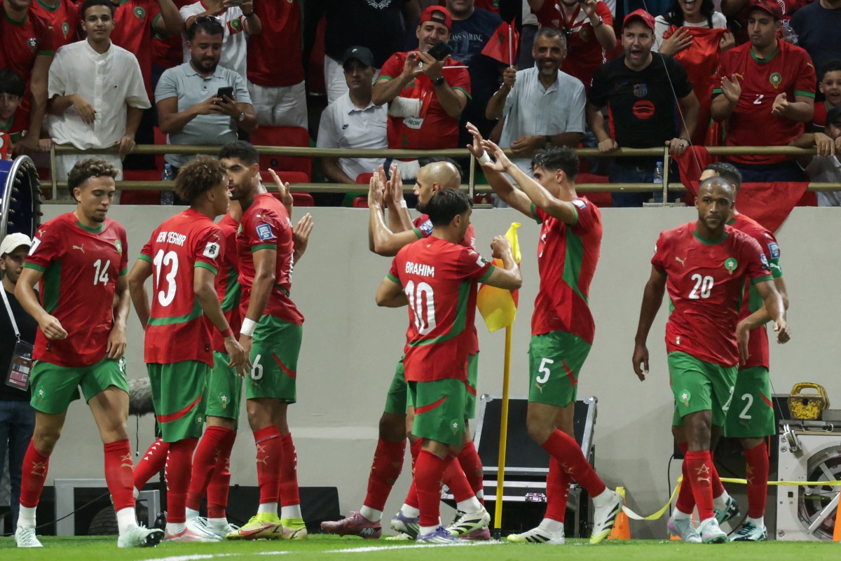 احتفال لاعبي المغرب (أ ف ب)