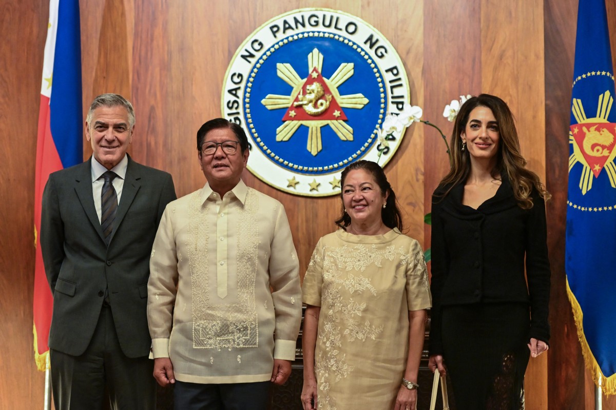 أمل وجورج كلوني في الفيليبين (أ ف ب)