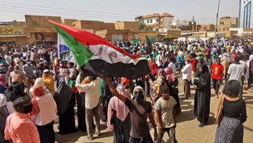 متظاهرون في الخرطوم احتجاجا على الانقلاب العسكري (13 ك2 2022، أ ف ب). 