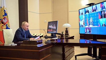 بوتين مترئسا اجتماعا لمجلس الأمن الروسي، عبر الفيديو، في مقر الإقامة نوفو أوغاريوفو الحكومي خارج موسكو (28 ك2 2022، أ ف ب). 