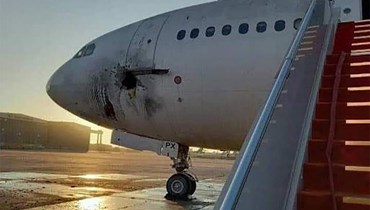 أضرار في جسم إحدى الطائرات الخارجة عن الخدمة في مطار بغداد الدولي (وزارة النقل العراقية).