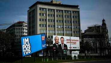 لافتة ضمن الحملات الانتخابية في لشبونة (أ ف ب).