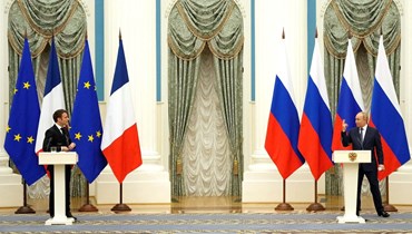 الرئيسان الروسي والفرنسي (ا ف ب).