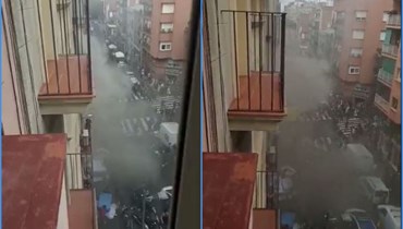 لقطتا شاشة من فيديو يظهر اشخاصا يقفزون من نوافذ الفندق المشتعل في برشلونة (Guillem Andres). 