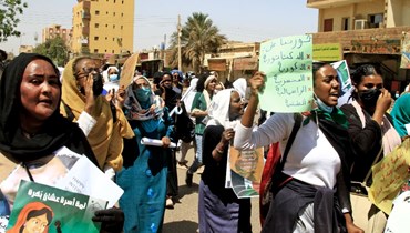 مسيرة لسودانيات في الخرطوم احتفالا باليوم العالمي للمرأة (8 آذار 2022، أ ف ب). 