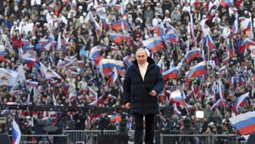 الرئيس الروسي فلاديمير بوتين لدى وصوله إلى إحتفال في إستاد بموسكو في مناسبة الذكرى الثامنة للإستفتاء في القرم (أ ب).