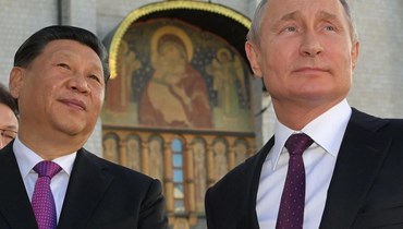 الرئيس الصيني شي جين بينغ ونظيره الروسي فلاديمير بوتين (أ ف ب).