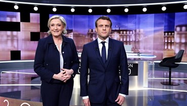 المرشحان للرئاسة الفرنسية ماكرون ولوبن في إطلالة تلفزيونية سابقة (أ ف ب).