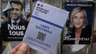 الانتخابات الفرنسية بين ماكرون ولوبن (أ ف ب).