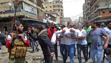 تشييع ضحايا "زورق الموت" في طرابلس (أ ف ب).
