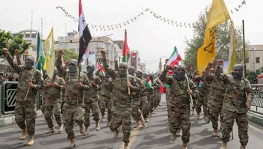 عناصر من قوات الباسيج الإيرانية يشاركون في مسيرة في طهران في ذكرى يوم القدس (20 نيسان 2022، أ ف ب). 