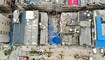 صورة جوية تظهر رجال إنقاذ في موقع انهيار المبنى في تشانغشا بمقاطعة هونان وسط الصين (29 نيسان 2022، أ ف ب). 