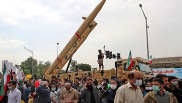 إيرانيون خلال مسيرة في طهران، في ذكرى يوم القدس (29 نيسان 2022، أ ف ب). 