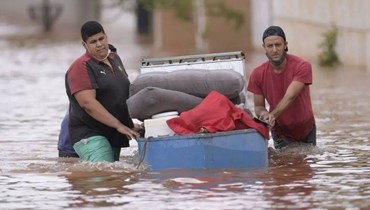 من آثار انهيارات طينية وسيول نجمت عن الأمطار الغزيرة في البرازيل (أ ف ب).