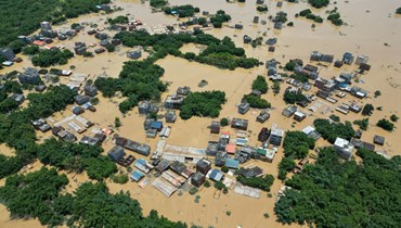 صورة جوية تظهر منطقة غمرتها المياه في ينجده بمدينة تشينغيوان في مقاطعة قوانغدونغ جنوب الصين (23 حزيران 2022، أ ف ب).